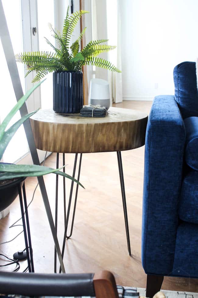 This gorgeous Modern Living Room reveal is finally here! This space came a long way from an outdated, empty space in this beautiful barn home. Love all of the contemporary DIY and decor ideas in this beautiful living space! The tiled fireplace and blue couch are stunning!