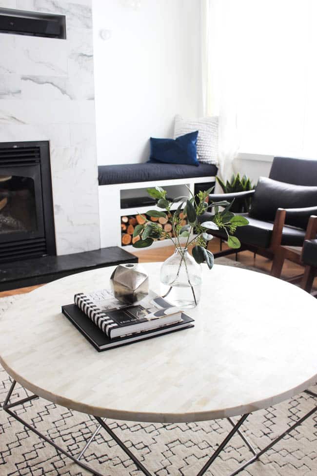 This gorgeous Modern Living Room reveal is finally here! This space came a long way from an outdated, empty space in this beautiful barn home. Love all of the contemporary DIY and decor ideas in this beautiful living space! The tiled fireplace and blue couch are stunning!