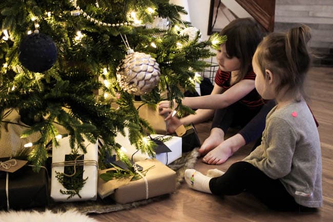 Girls sitting with the Christmas Tree! 