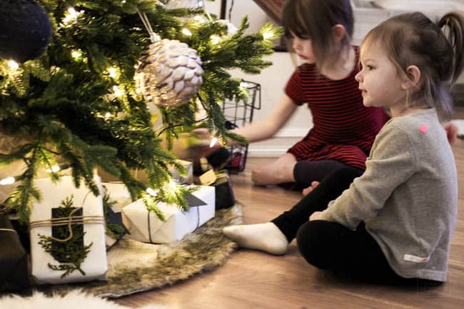 Girls sitting with the Christmas Tree! 