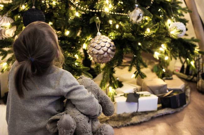 Girls sitting with the Christmas Tree! 