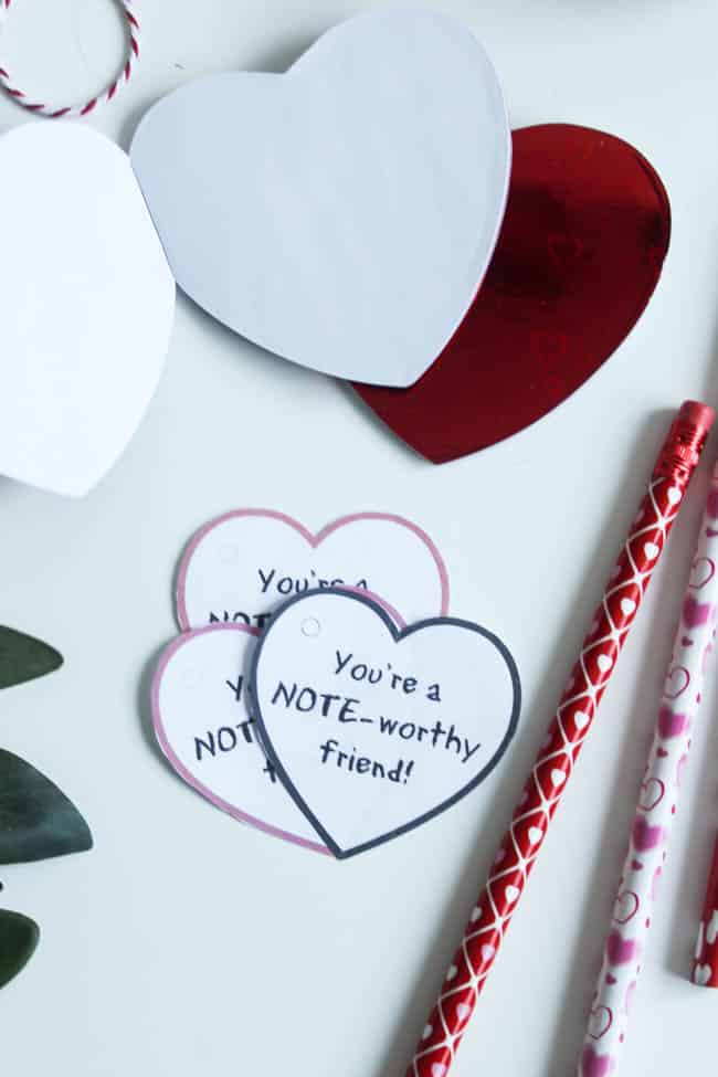 Simple Notebook Valentines using Dollar Store notebooks and pencils! Download the FREE printable Valentines now for your kids to take to school!