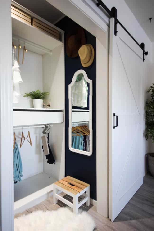 The deep blue in our master bedroom closet looks great with all the white accents.