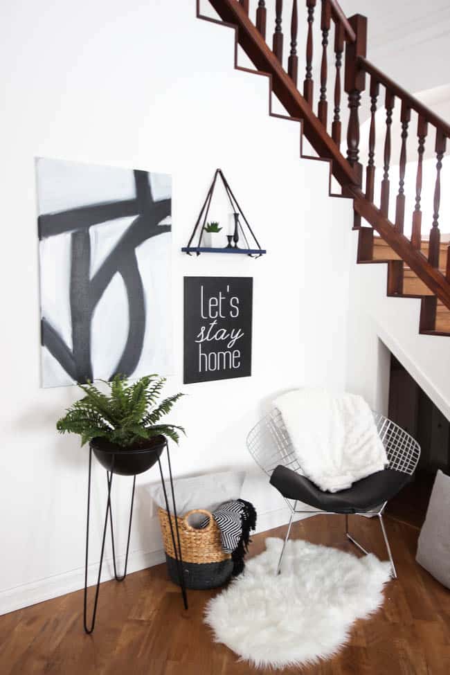 Love this simple modern shelf idea! This simple DIY hanging shelf makes the perfect wall art. If you have some scrap wood and leather you can make this floating shelf in no time! 