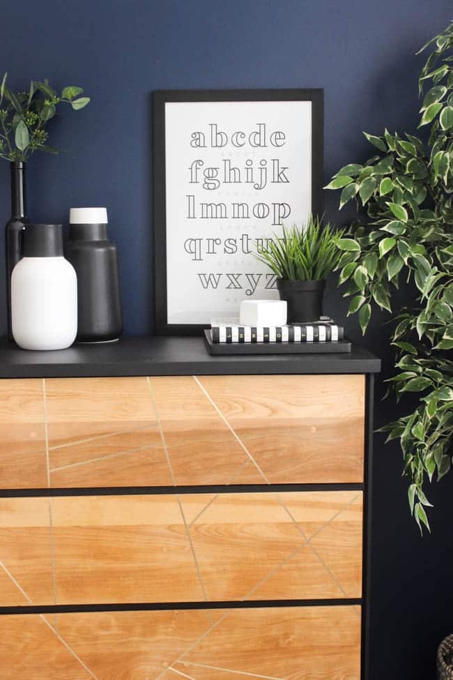 I love the metallic touch of the faux letter inlay on this beautiful dresser makeover