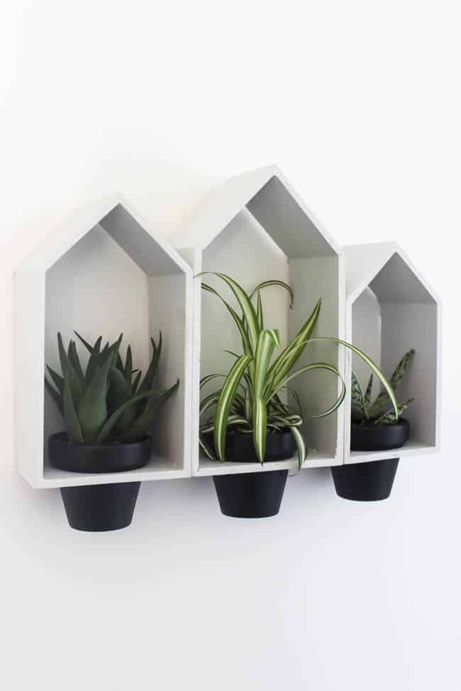 DIY modern hanging wall planters on a white wall.