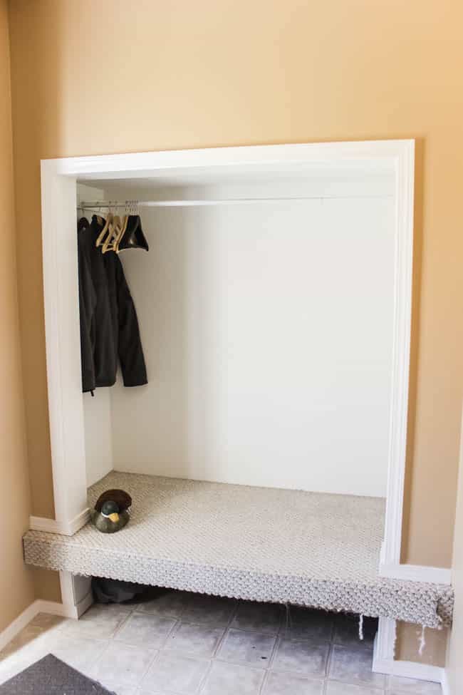 Wow! Beautiful modern entry design plans! Watch these homeowners transform this outdated mudroom into a beautiful, functional, and affordable entry! Love the black, white and wood colour palette and the herringbone floors in the new design!