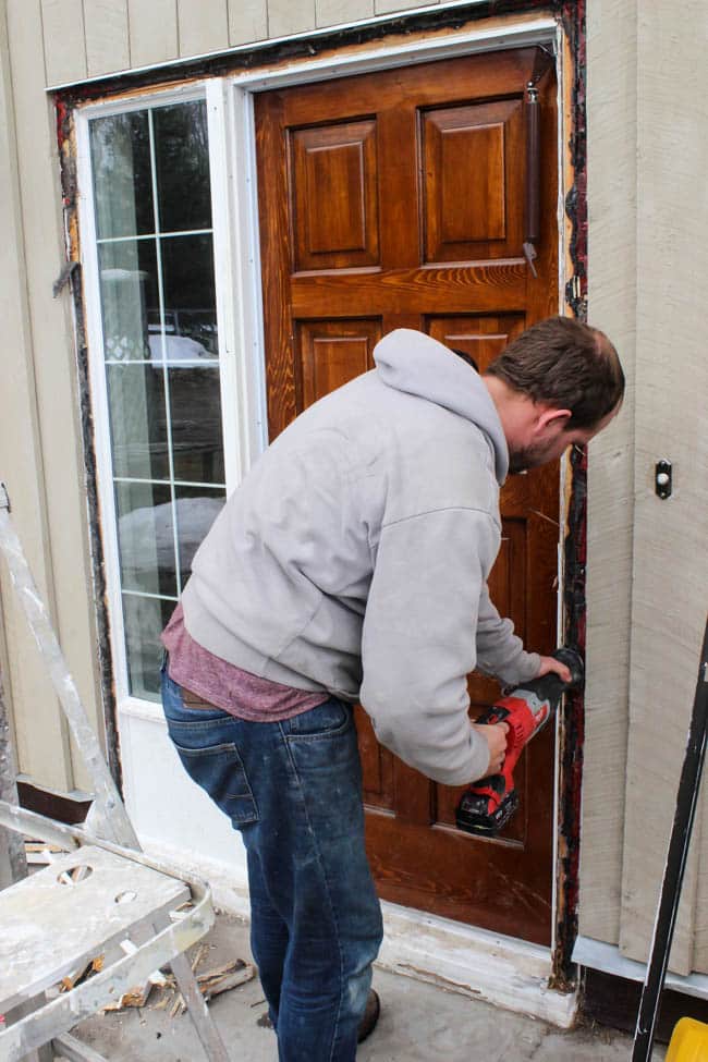 Thinking about replacing your front door? This is everything you need to know before you walk into The Home Depot and pick out a new design! We share how we got the proper measurements and picked our design elements before going to the store. Love the modern design of this new black front door!