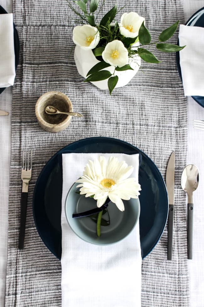 A pretty Mother's Day Tablescape. Love the earthy colours in this black, white, blue and green table setting! Beautiful floral centrepieces and modern place settings will make for the perfect spring event!