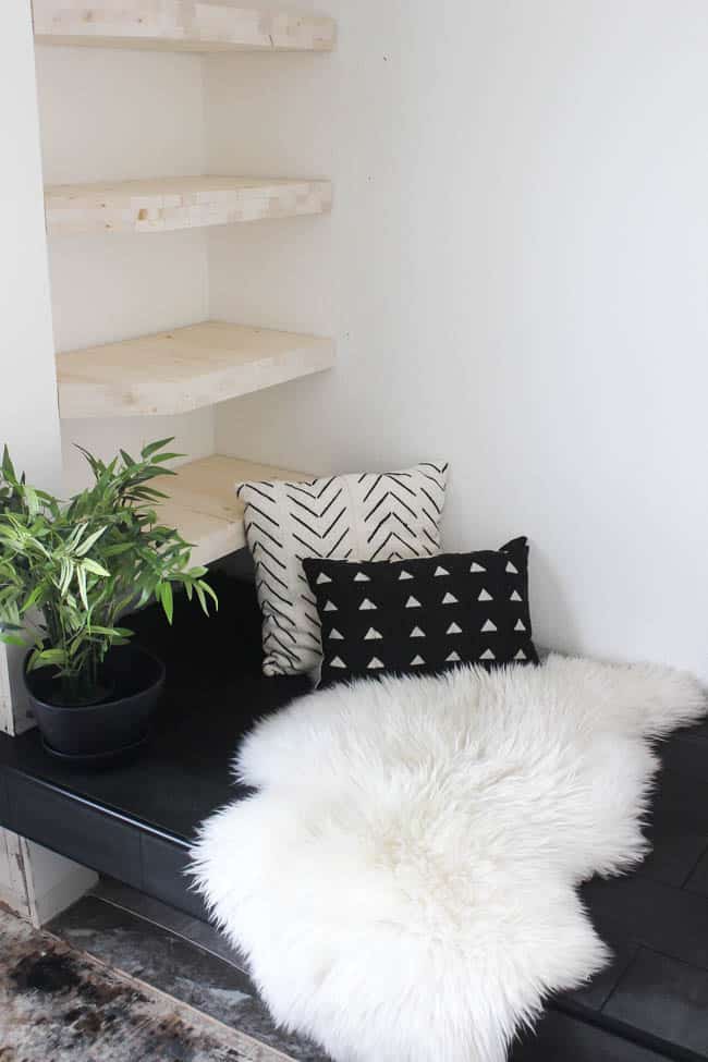 Gorgeous Tiled Entry Bench! Love the use of tile on this creative DIY project! The basalt tile looks amazing on this tiled bench seat. Great modern design for a tiled entryway!