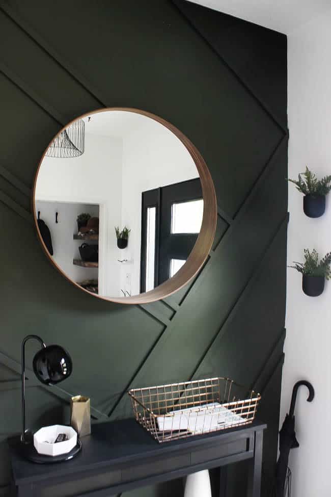 Love this simple round mirror in our new modern entryway