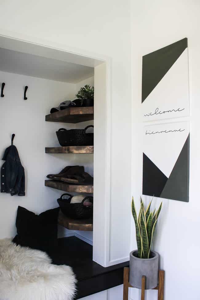 The artwork makes this modern entryway look stylish and sleek