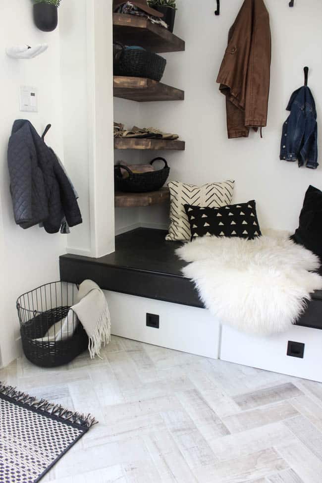 This storage nook in our redesigned modern style entry way adds a touch of rustic flair with wooden shelves
