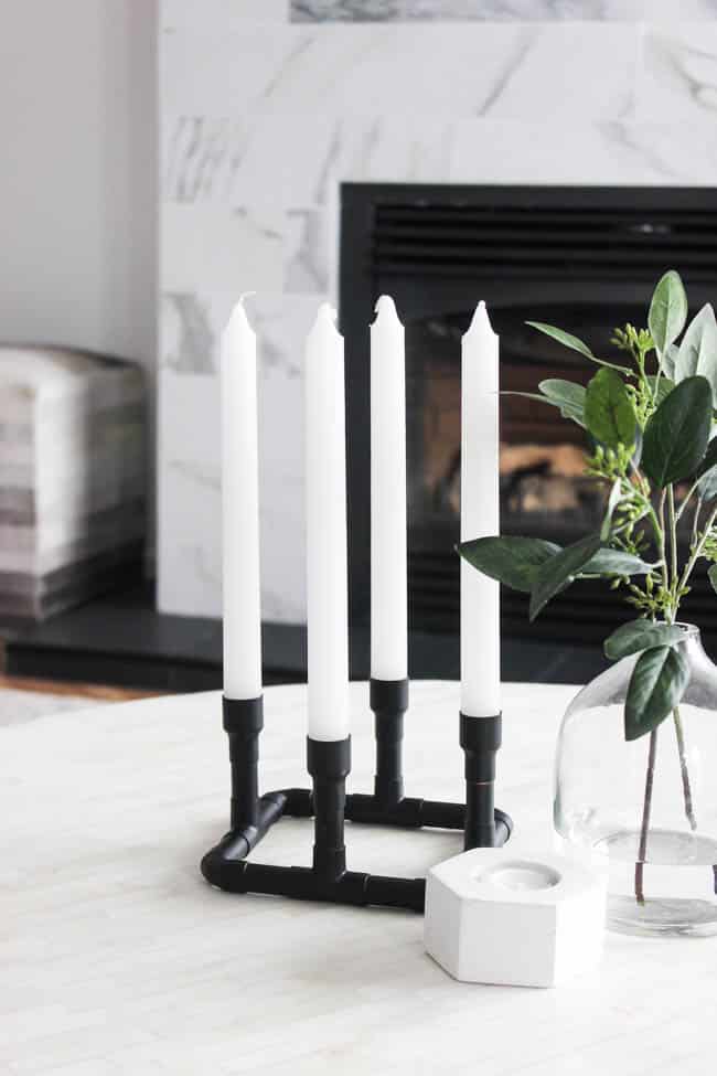 Wow! DIY candle holders have never been so easy! Such a creative use of copper pipe and spray paint! Love this easy modern decor idea! These easy candlesticks would be beautiful as centerpieces or sitting on a shelf!