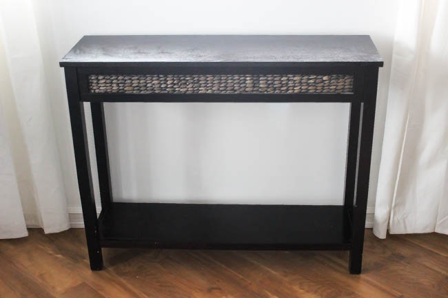 Beautiful Furniture Transformation! Use leftover tile to upcycle an old console table into a beautiful, modern piece in just a few steps. Beautiful narrow table for the entry or hallway. Such a wonderful use of leftover tile!