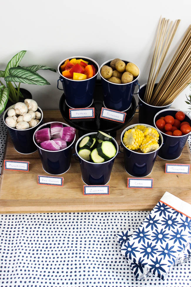 DIY Shish Kabob Bar! What an amazing idea for entertaining friends and family! Set-up your kabob bar by the BBQ and let everyone enjoy their own delicious shish kabobs.