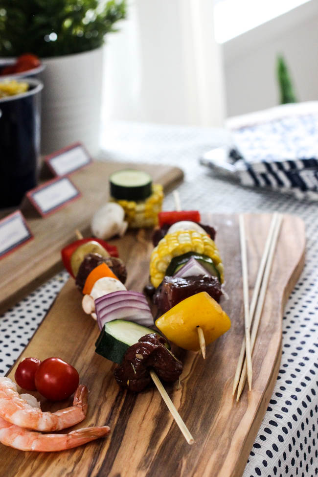 DIY Shish Kabob Bar! What an amazing idea for entertaining friends and family! Set-up your kabob bar by the BBQ and let everyone enjoy their own delicious shish kabobs.