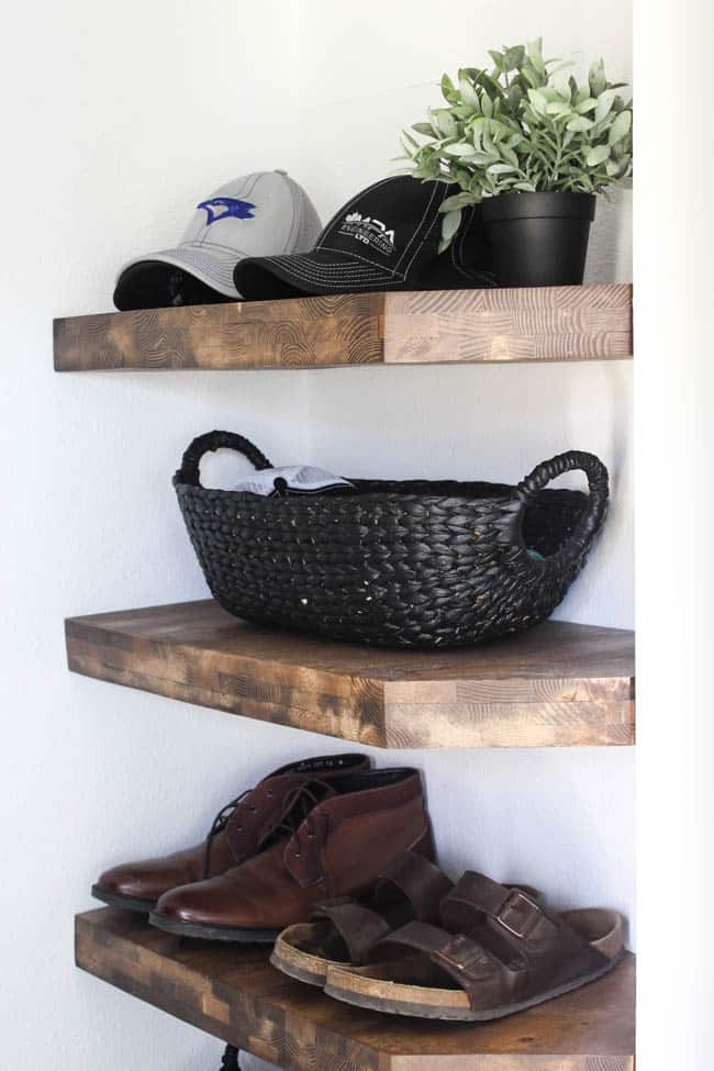 Beautiful black baskets! Make your own in five minutes by painting any old basket with the best black paint! Beautiful storage idea for this modern entry!