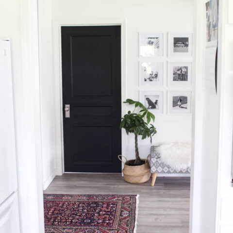 Stunning transformation! Transform outdated doors on a budget! Some trim, paint, and new hardware is all it takes to create a new modern interior door design! Love the navy blue colour on these hallway doors.