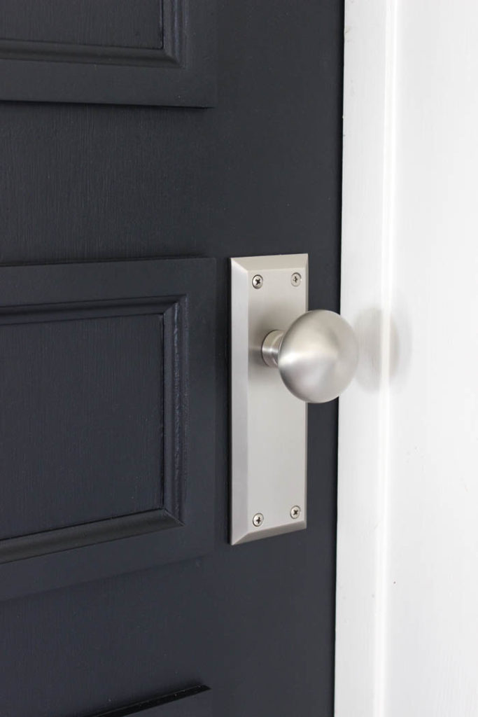 A close up image of the door knob of a renovated hollow core door 