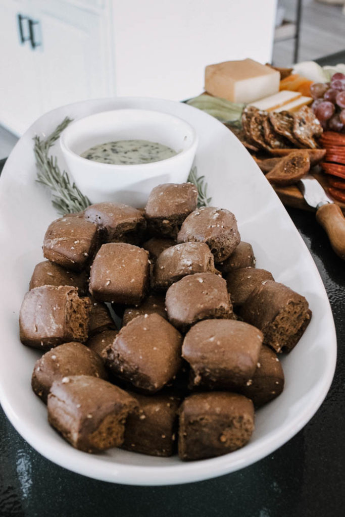 Sweet and savory flavors come together for this fall-themed appetizer spread complete with spinach dip and rye rolls