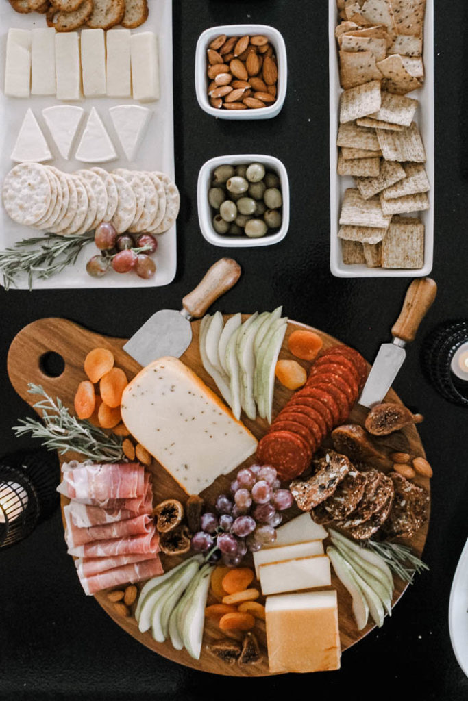 This sweet and savory spread is complete with a Fall charcuterie board, a variety of crackers and fruit.