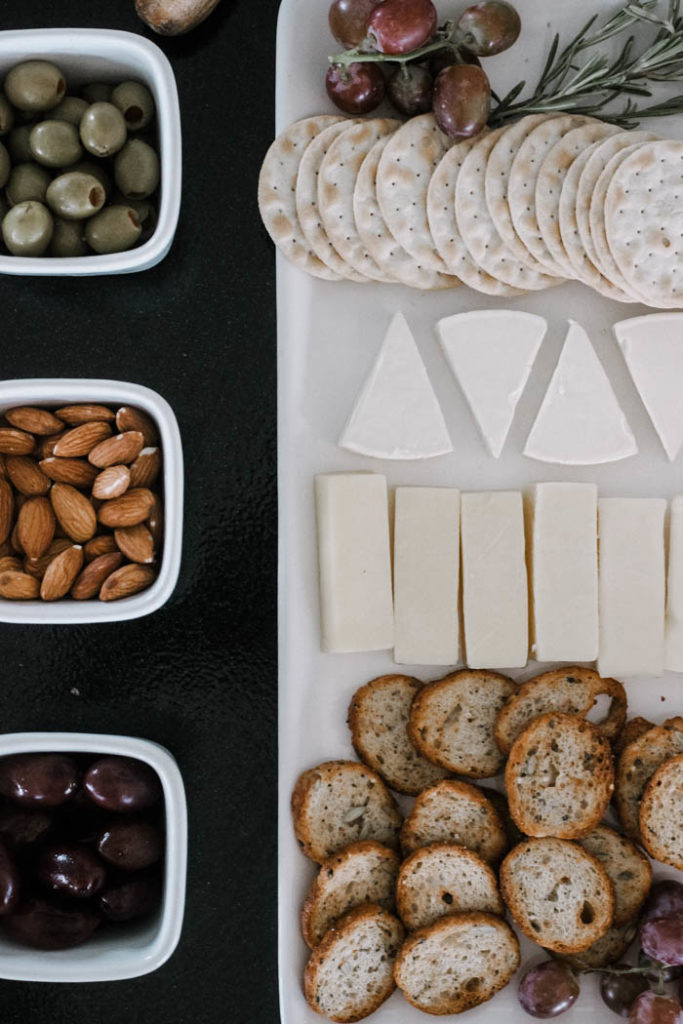 Make your fall charcuterie board easy by using prepackaged food like cheeses, nuts, and bread or cracker slices