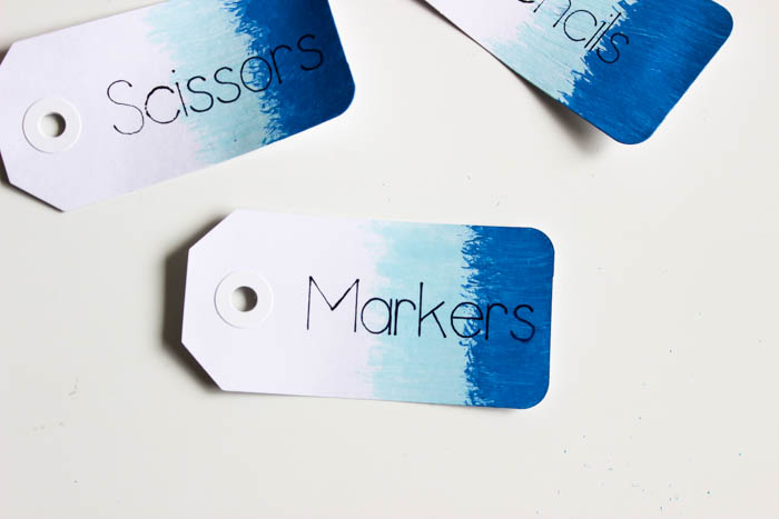 Don't like your handwriting?? Use the Cricut to write all of your tags, gift cards, envelopes! Great tutorial for showing you how to use the Cricut writing pens on materials you already have. LOVE this simple way to organize school supplies at home! The ombre tags are so cute!