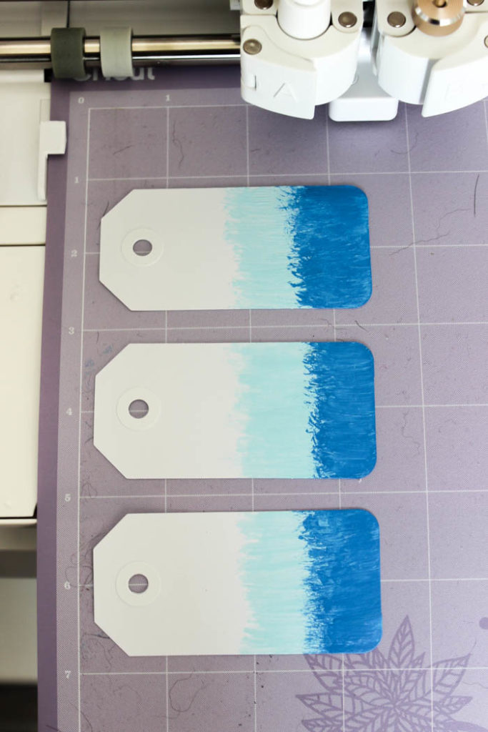 Don't like your handwriting?? Use the Cricut to write all of your tags, gift cards, envelopes! Great tutorial for showing you how to use the Cricut writing pens on materials you already have. LOVE this simple way to organize school supplies at home! The ombre tags are so cute!