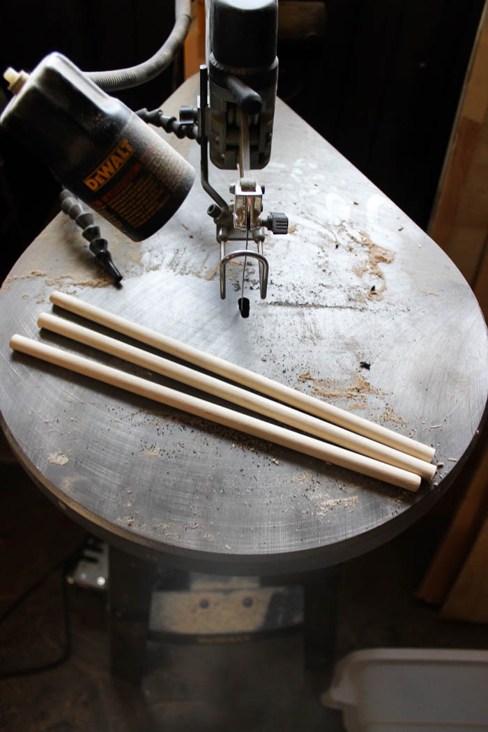 A scroll saw and dowels, cut into even pieces