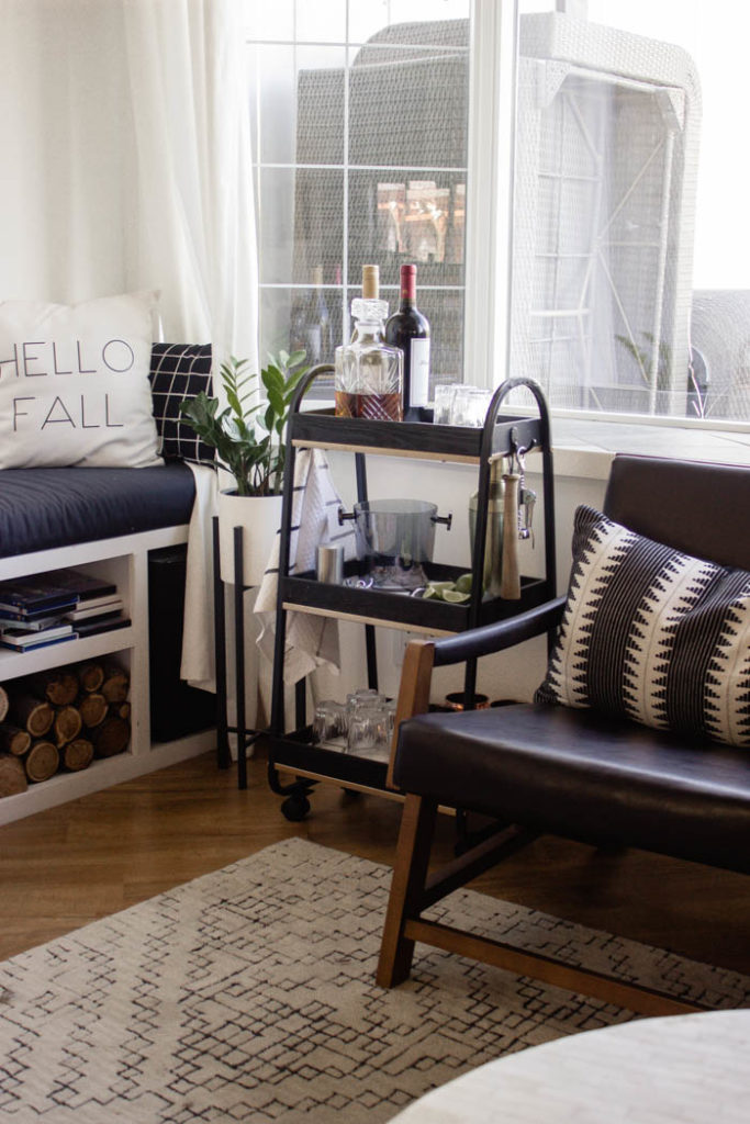 This modern bar cart is stunning! It's hard to believe that this is a DIY! Love the tile inlays and the mix of black, white, and gold in the design. Beautiful bar cart styling and ideas for your home entertaining! #DIY #barcart #tile #luxe #modern