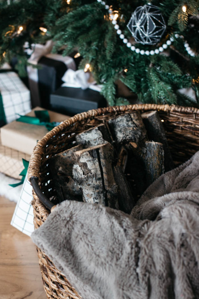 A stunning modern Christmas home tour! Love all of the monochromatic decor in this natural home tour. Beautiful black and white palette for this holiday living room! #moderndecor #monochrome #Christmas #modernChristmas #hometour