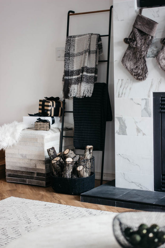 A stunning modern Christmas home tour! Love all of the monochromatic decor in this natural home tour. Beautiful black and white palette for this holiday living room! #moderndecor #monochrome #Christmas #modernChristmas #hometour