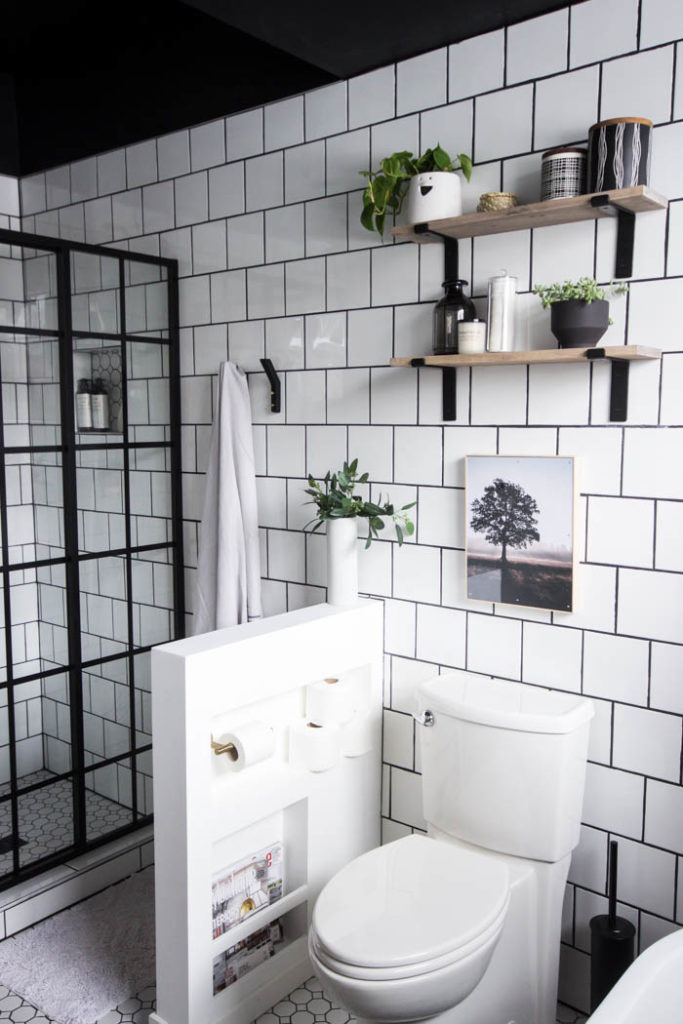 Love the look of this simple bathroom shelving! The open shelving is beautiful and so easy to build! Get tips and tricks for drilling into tile too! Love the modern bathroom design. #moderndesign #bathroom #DIY 