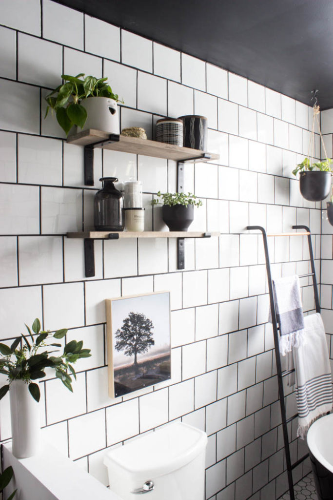 Love the look of this simple bathroom shelving! The open shelving is beautiful and so easy to build! Get tips and tricks for drilling into tile too! Love the modern bathroom design. #moderndesign #bathroom #DIY 