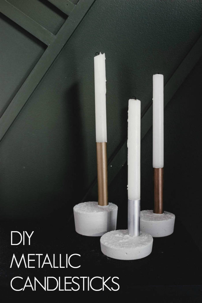 Beautiful metallic candlesticks made with copper pipe, spray paint, and fast drying concrete mix! You'll love this quick and easy DIY project. It's the perfect modern gift idea! #concrete #copperpipe #moderndecor #industrialdecor #industrial #mixedmetals 