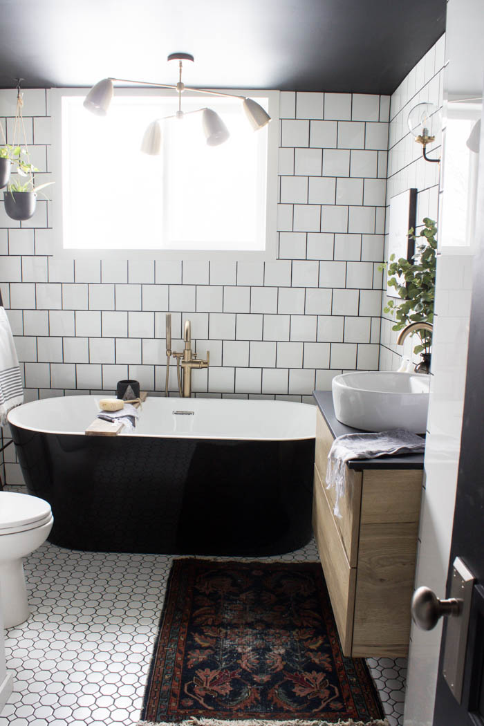 Tub in the modern bathroom reveal.