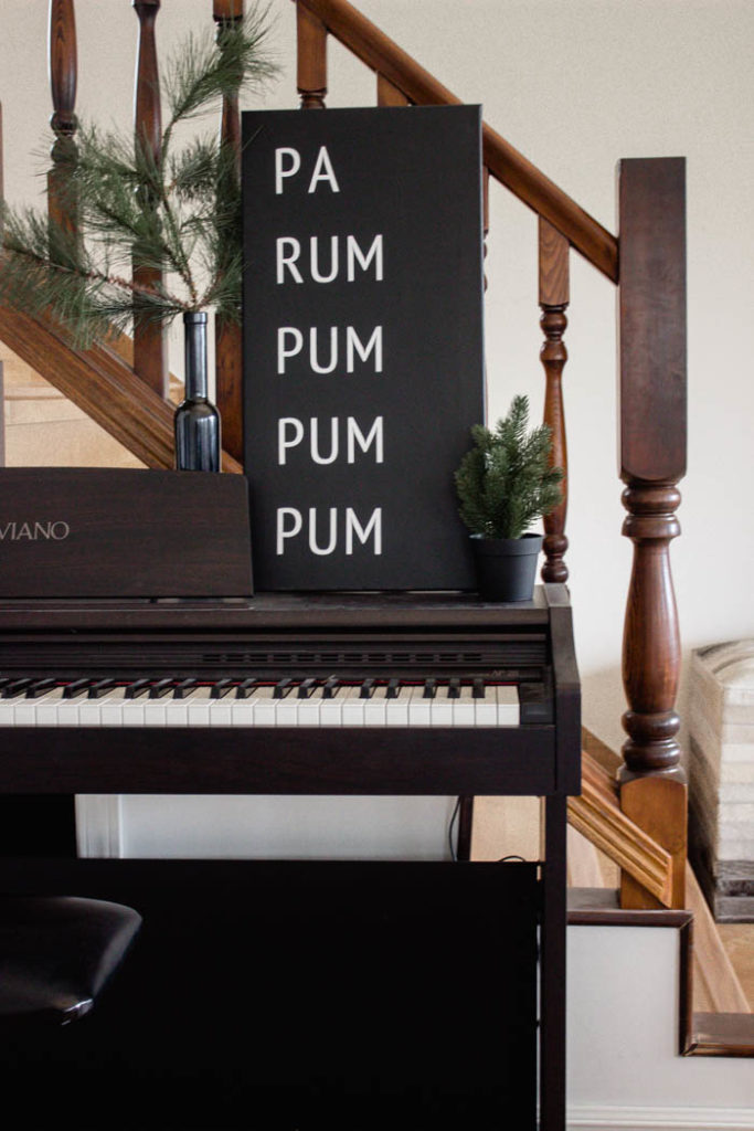 A beautiful Modern DIY sign for the holiday season! Love this simple Pa Rum Pum Pum Pum Christmas sign! What a fun way to share the song lyrics and decorate your home. #Christmas #holidaysign #DIYart #ModernChristmas #blackandwhite #homedecor