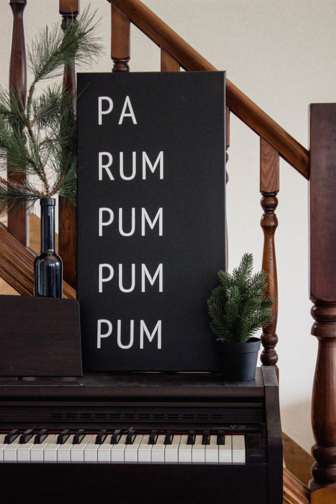 A beautiful Modern DIY sign for the holiday season! Love this simple Pa Rum Pum Pum Pum Christmas sign! What a fun way to share the song lyrics and decorate your home. #Christmas #holidaysign #DIYart #ModernChristmas #blackandwhite #homedecor