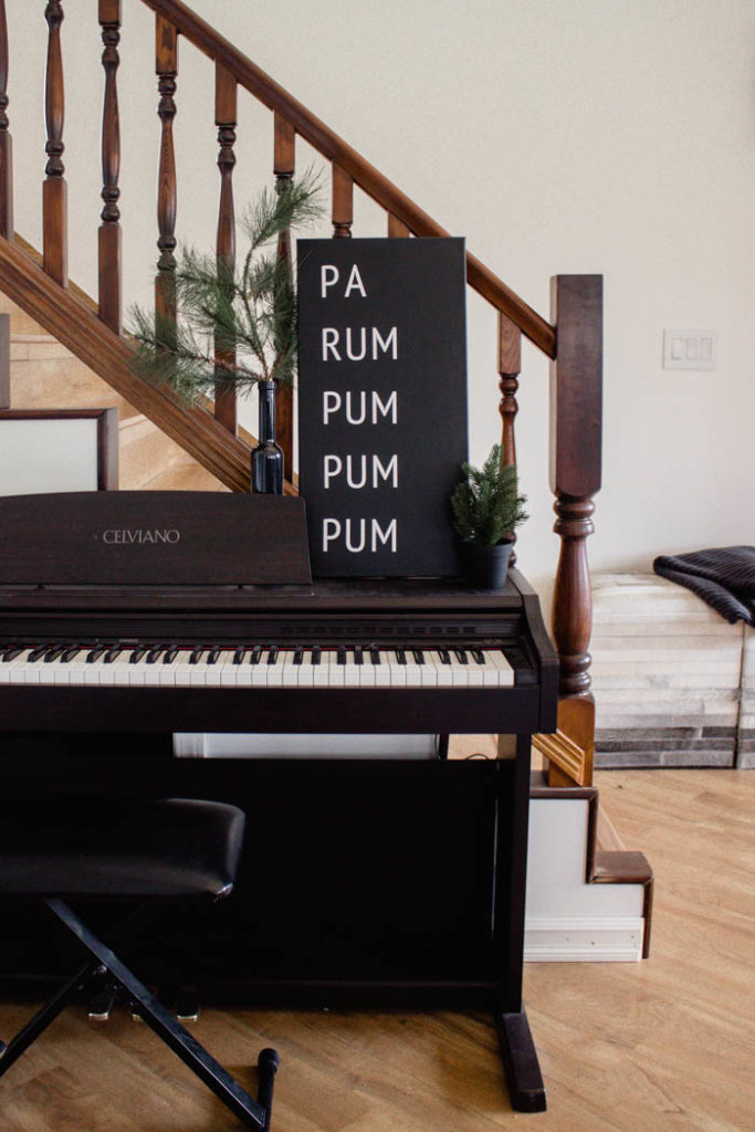 A beautiful Modern DIY sign for the holiday season! Love this simple Pa Rum Pum Pum Pum Christmas sign! What a fun way to share the song lyrics and decorate your home. #Christmas #holidaysign #DIYart #ModernChristmas #blackandwhite #homedecor