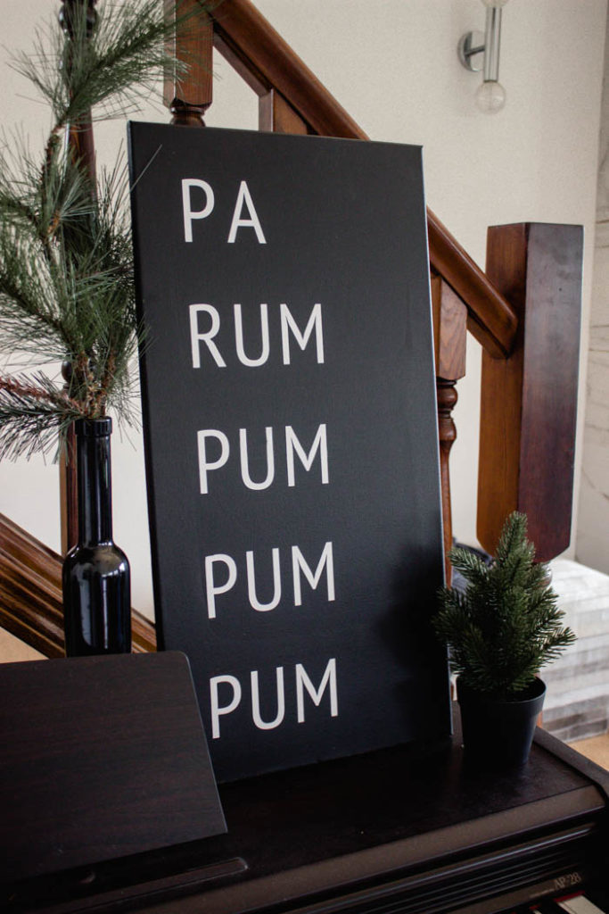 A beautiful Modern DIY sign for the holiday season! Love this simple Pa Rum Pum Pum Pum Christmas sign! What a fun way to share the song lyrics and decorate your home. #Christmas #holidaysign #DIYart #ModernChristmas #blackandwhite #homedecor