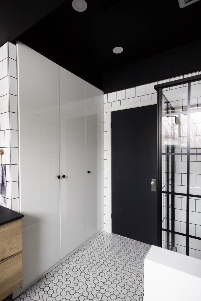 Storage and tile flooring in the modern bathroom.