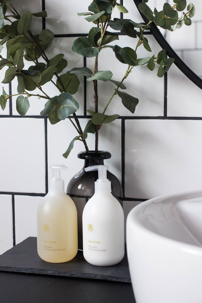 Decorations on the vanity in the modern bathroom.