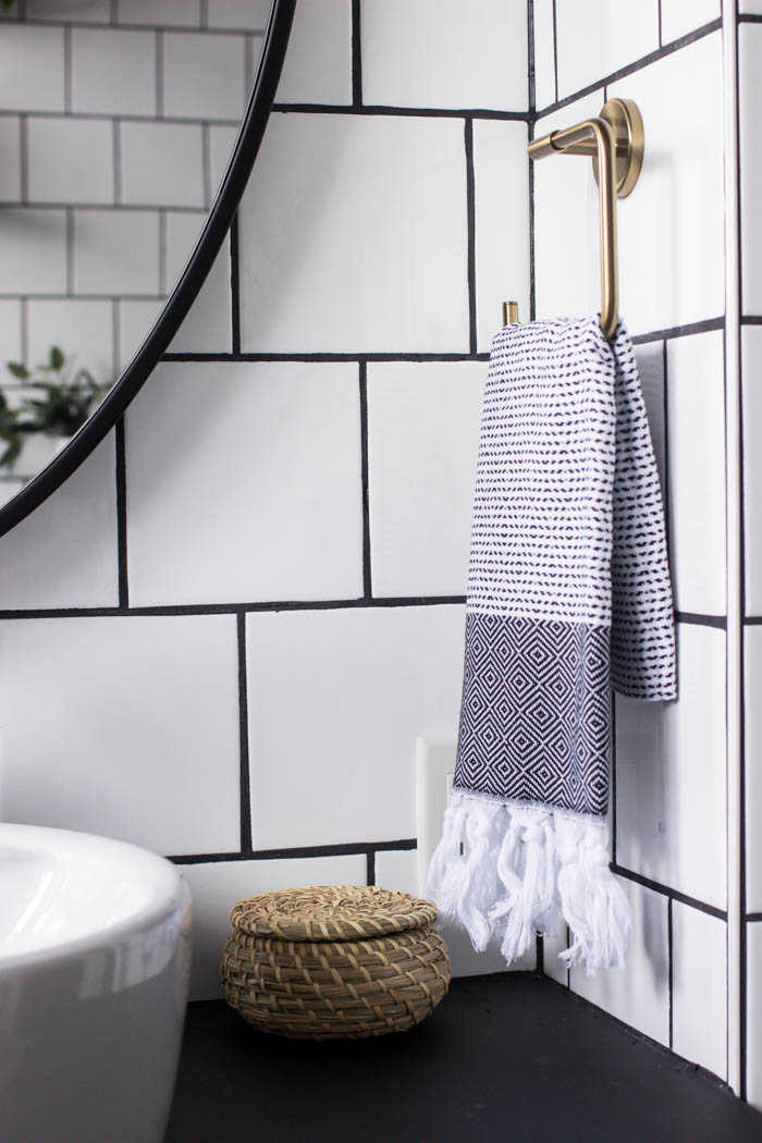 Hand towel and decorations in the modern bathroom reveal.