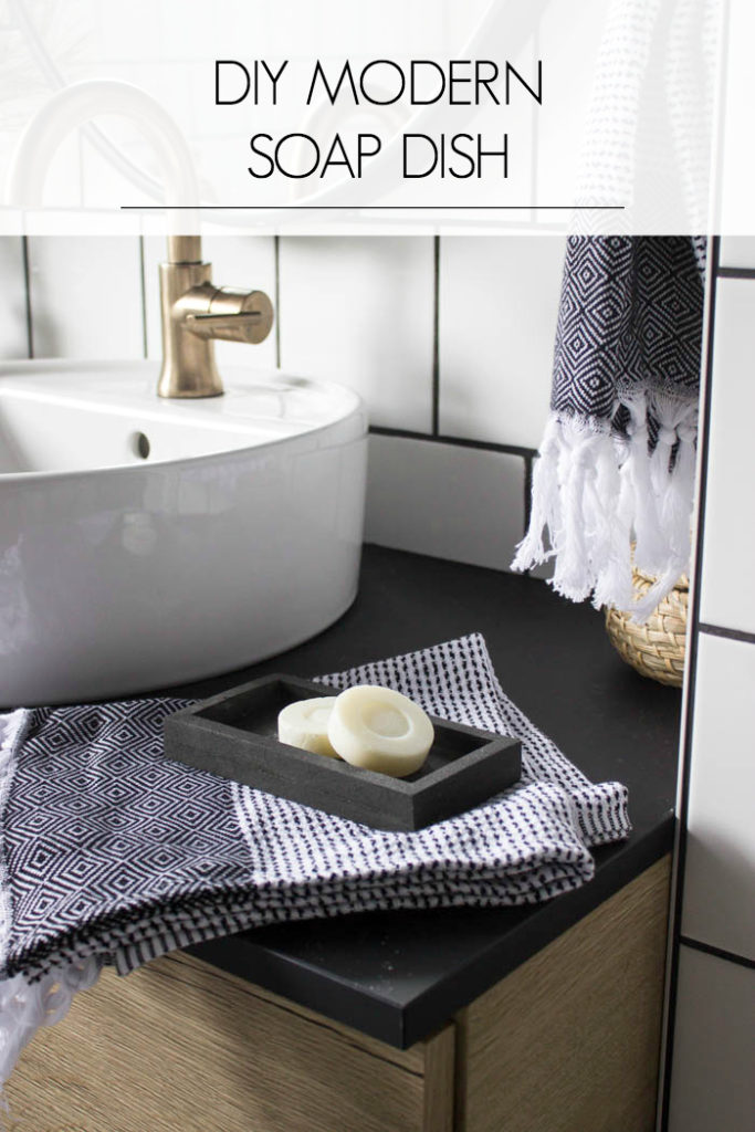 Sleek modern soap dish! Love this easy modern DIY using leftover tile! Love the chic and masculine feel to this modern DIY project on a budget. Looks amazing in this modern bathroom! #budgetfriendly #modernbathroom #basalt #leftovertile #makeover 