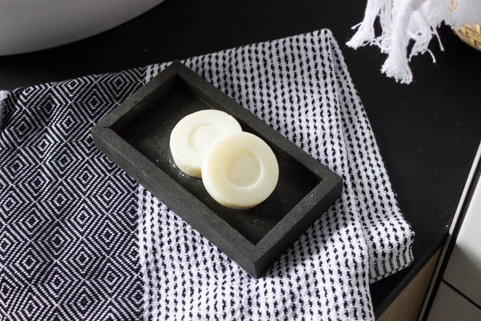 Sleek modern soap dish! Love this easy modern DIY using leftover tile! Love the chic and masculine feel to this modern DIY project on a budget. Looks amazing in this modern bathroom! #budgetfriendly #modernbathroom #basalt #leftovertile #makeover 