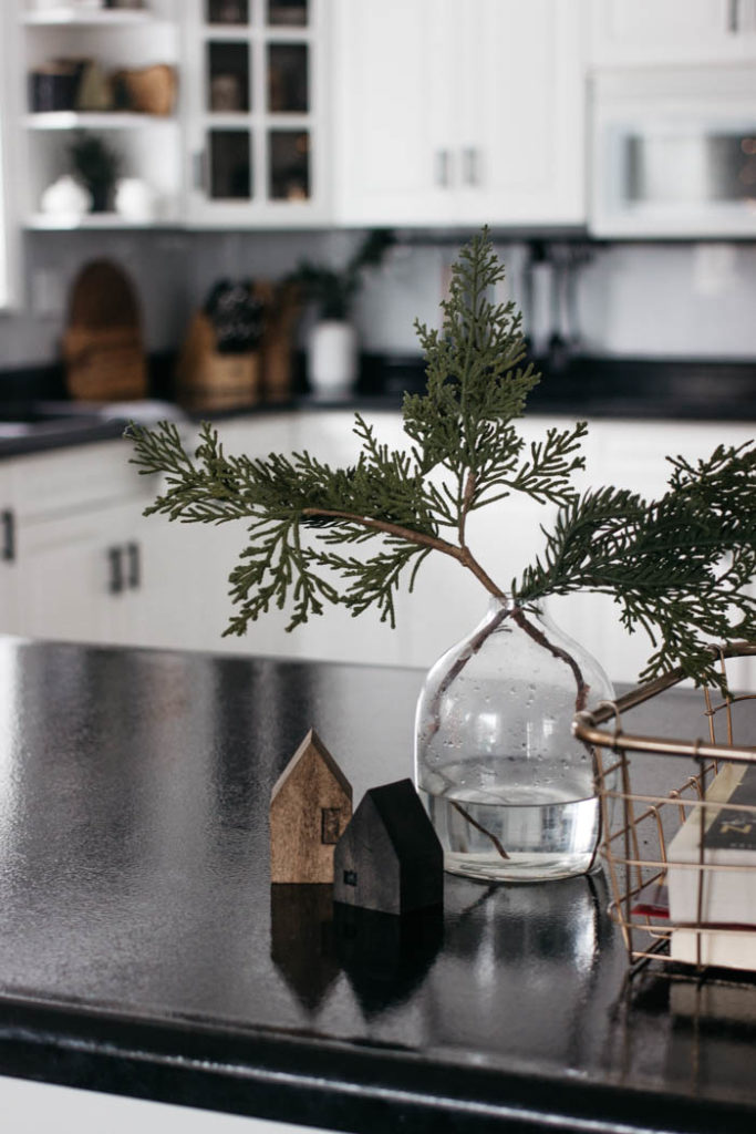 These DIY Mini Wooden Houses are adorable! Love the simple & modern design. The dark stains are beautiful. It's the perfect addition to any coffee table or shelf styling! A great scrap wood project! #scrapwood #winterdecor #holiday #minihouse #woodworking