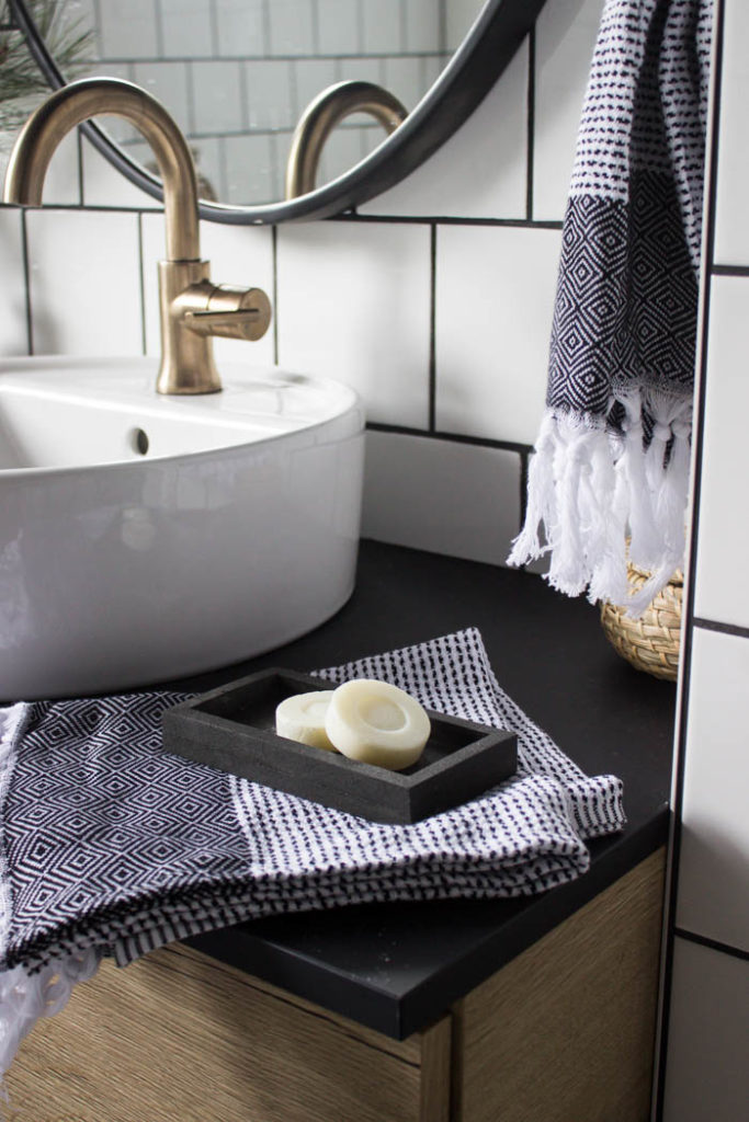 Sleek modern soap dish! Love this easy modern DIY using leftover tile! Love the chic and masculine feel to this modern DIY project on a budget. Looks amazing in this modern bathroom! #budgetfriendly #modernbathroom #basalt #leftovertile #makeover 