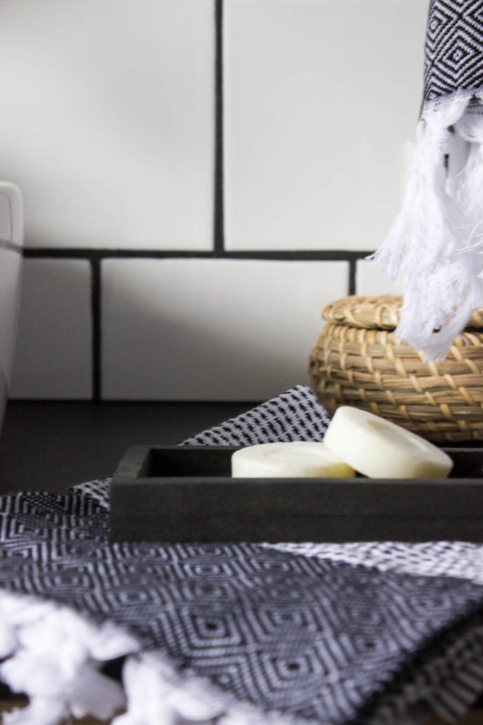 Sleek modern soap dish! Love this easy modern DIY using leftover tile! Love the chic and masculine feel to this modern DIY project on a budget. Looks amazing in this modern bathroom! #budgetfriendly #modernbathroom #basalt #leftovertile #makeover 