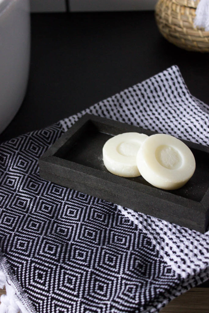 Sleek modern soap dish! Love this easy modern DIY using leftover tile! Love the chic and masculine feel to this modern DIY project on a budget. Looks amazing in this modern bathroom! #budgetfriendly #modernbathroom #basalt #leftovertile #makeover 